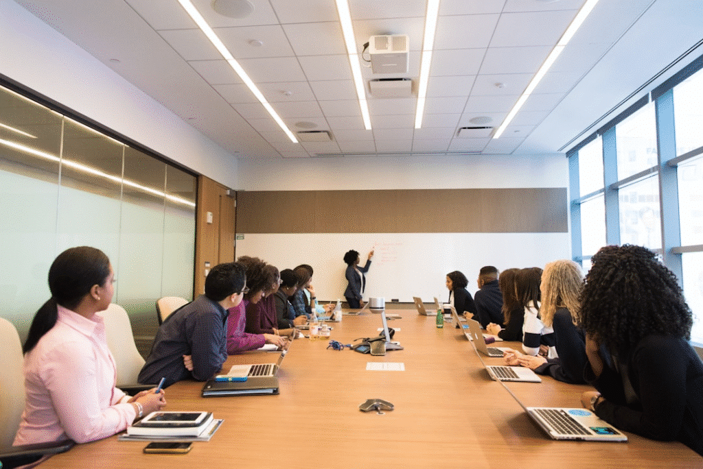 Team members collaborating in an office conference room exploring seamless integration and how newsletter software enhances your marketing ecosystem